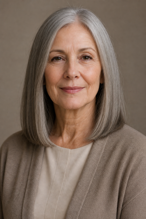 Elegant short layered hairstyle for women over 70 with soft volume and natural gray hair